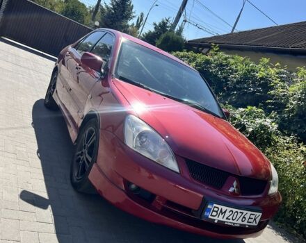Червоний Міцубісі Lancer, об'ємом двигуна 2 л та пробігом 330 тис. км за 3500 $, фото 1 на Automoto.ua