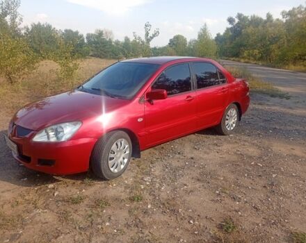 Червоний Міцубісі Lancer, об'ємом двигуна 1.6 л та пробігом 248 тис. км за 3550 $, фото 1 на Automoto.ua