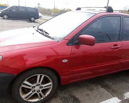 Красный Мицубиси Лансер, объемом двигателя 2 л и пробегом 320 тыс. км за 4600 $, фото 1 на Automoto.ua