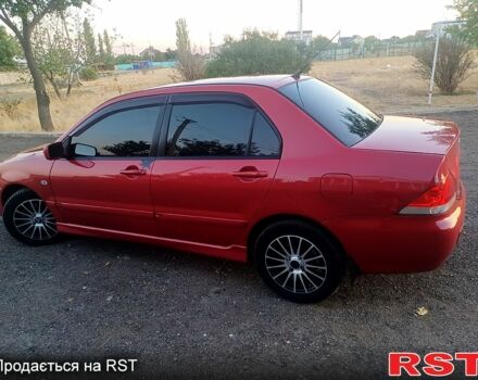 Червоний Міцубісі Lancer, об'ємом двигуна 1.6 л та пробігом 260 тис. км за 4600 $, фото 1 на Automoto.ua