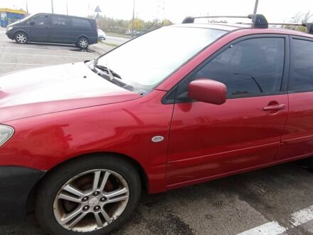 Красный Мицубиси Лансер, объемом двигателя 2 л и пробегом 320 тыс. км за 4600 $, фото 1 на Automoto.ua