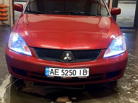 Мицубиси Лансер 2006 в Харькове на Automoto.ua Красный Мицубиси Лансер, объемом двигателя 2 л и пробегом 200 тыс. км за 5200 $, фото 1 на Automoto.ua