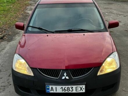 Красный Мицубиси Лансер, объемом двигателя 1.6 л и пробегом 290 тыс. км за 2800 $, фото 1 на Automoto.ua