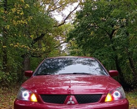 Червоний Міцубісі Lancer, об'ємом двигуна 2 л та пробігом 225 тис. км за 5505 $, фото 1 на Automoto.ua