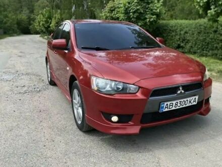 Червоний Міцубісі Lancer, об'ємом двигуна 2 л та пробігом 196 тис. км за 4600 $, фото 1 на Automoto.ua