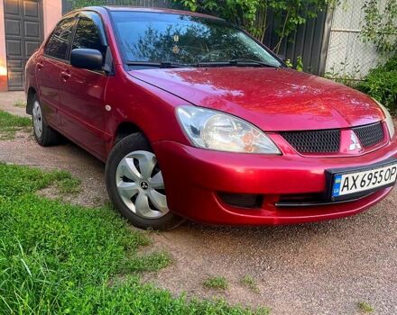 Красный Мицубиси Лансер, объемом двигателя 1.6 л и пробегом 185 тыс. км за 3900 $, фото 1 на Automoto.ua