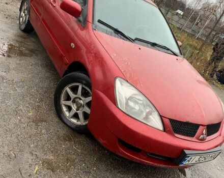 Червоний Міцубісі Lancer, об'ємом двигуна 1.6 л та пробігом 300 тис. км за 2799 $, фото 1 на Automoto.ua