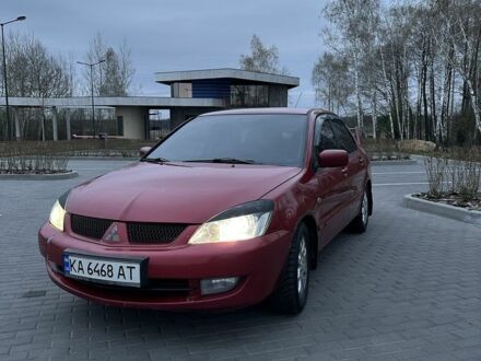 Красный Мицубиси Лансер, объемом двигателя 1.6 л и пробегом 280 тыс. км за 4650 $, фото 1 на Automoto.ua