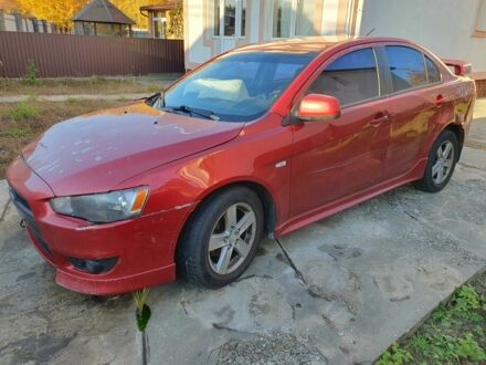Красный Мицубиси Лансер, объемом двигателя 2 л и пробегом 406 тыс. км за 2750 $, фото 1 на Automoto.ua