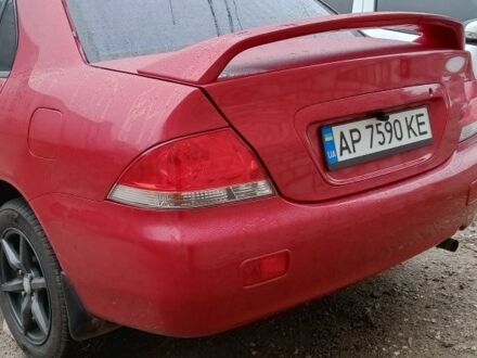 Красный Мицубиси Лансер, объемом двигателя 1.6 л и пробегом 155 тыс. км за 2000 $, фото 1 на Automoto.ua
