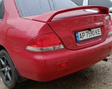 Красный Мицубиси Лансер, объемом двигателя 1.6 л и пробегом 155 тыс. км за 2000 $, фото 1 на Automoto.ua