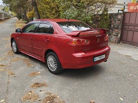 Красный Мицубиси Лансер, объемом двигателя 2 л и пробегом 187 тыс. км за 5500 $, фото 1 на Automoto.ua