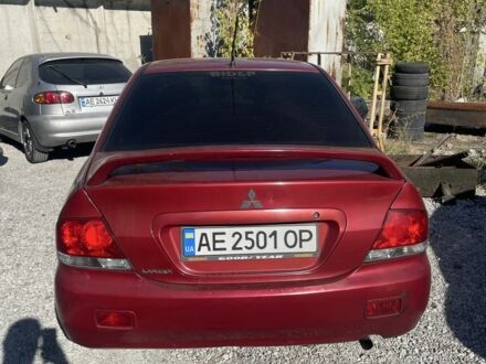 Червоний Міцубісі Lancer, об'ємом двигуна 1.6 л та пробігом 245 тис. км за 3000 $, фото 1 на Automoto.ua