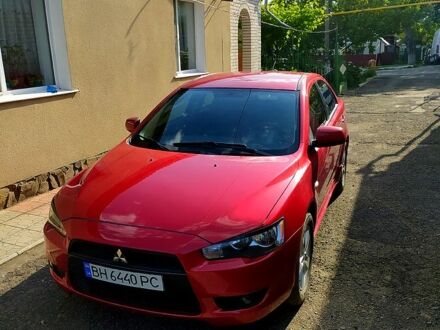 Червоний Міцубісі Lancer, об'ємом двигуна 2 л та пробігом 1 тис. км за 7200 $, фото 1 на Automoto.ua