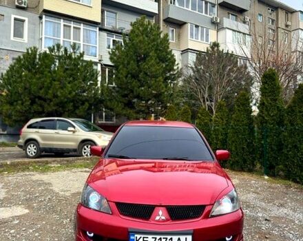 Червоний Міцубісі Lancer, об'ємом двигуна 2 л та пробігом 218 тис. км за 5100 $, фото 1 на Automoto.ua