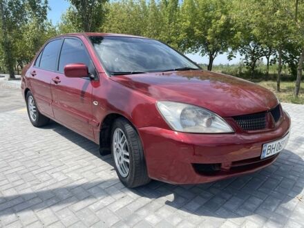 Червоний Міцубісі Lancer, об'ємом двигуна 1.6 л та пробігом 250 тис. км за 3300 $, фото 1 на Automoto.ua