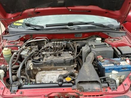 Червоний Міцубісі Lancer, об'ємом двигуна 1.6 л та пробігом 215 тис. км за 4864 $, фото 1 на Automoto.ua