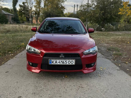 Красный Мицубиси Лансер, объемом двигателя 2 л и пробегом 191 тыс. км за 7200 $, фото 1 на Automoto.ua