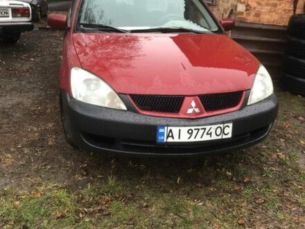 Красный Мицубиси Лансер, объемом двигателя 1.6 л и пробегом 286 тыс. км за 3450 $, фото 1 на Automoto.ua