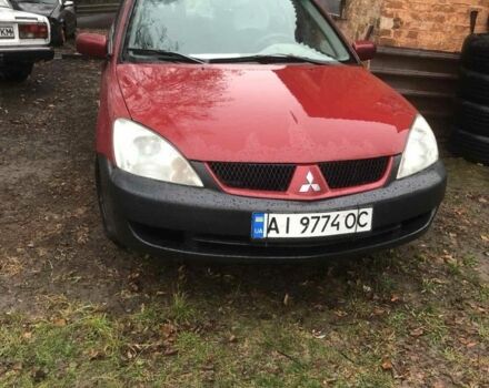 Красный Мицубиси Лансер, объемом двигателя 1.6 л и пробегом 286 тыс. км за 3450 $, фото 1 на Automoto.ua