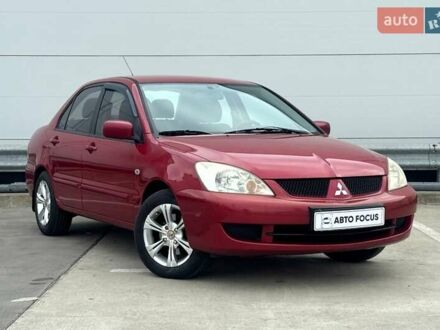 Красный Мицубиси Лансер, объемом двигателя 1.59 л и пробегом 212 тыс. км за 5490 $, фото 1 на Automoto.ua