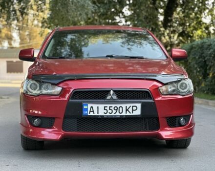 Червоний Міцубісі Lancer, об'ємом двигуна 2 л та пробігом 307 тис. км за 6500 $, фото 1 на Automoto.ua