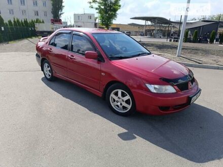 Червоний Міцубісі Lancer, об'ємом двигуна 1.6 л та пробігом 200 тис. км за 4350 $, фото 1 на Automoto.ua