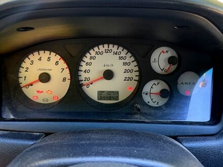 Червоний Міцубісі Lancer, об'ємом двигуна 1.6 л та пробігом 344 тис. км за 4000 $, фото 1 на Automoto.ua