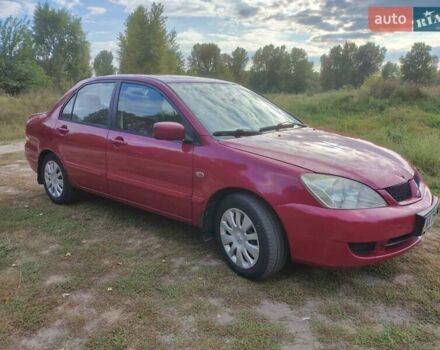 Красный Мицубиси Лансер, объемом двигателя 1.58 л и пробегом 264 тыс. км за 3900 $, фото 1 на Automoto.ua