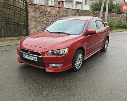 Червоний Міцубісі Lancer, об'ємом двигуна 2 л та пробігом 186 тис. км за 5600 $, фото 1 на Automoto.ua