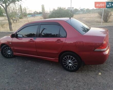 Червоний Міцубісі Lancer, об'ємом двигуна 1.6 л та пробігом 260 тис. км за 4600 $, фото 1 на Automoto.ua