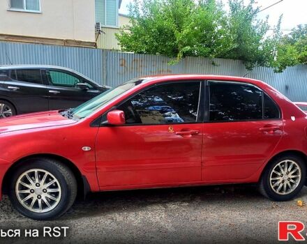 Червоний Міцубісі Lancer, об'ємом двигуна 1.6 л та пробігом 255 тис. км за 4600 $, фото 1 на Automoto.ua