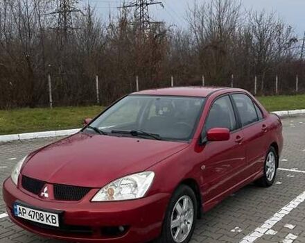Красный Мицубиси Лансер, объемом двигателя 1.6 л и пробегом 176 тыс. км за 4300 $, фото 1 на Automoto.ua