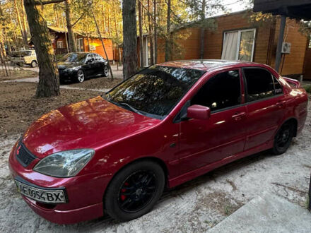 Красный Мицубиси Лансер, объемом двигателя 2 л и пробегом 250 тыс. км за 4500 $, фото 1 на Automoto.ua