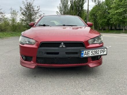 Червоний Міцубісі Lancer, об'ємом двигуна 2 л та пробігом 177 тис. км за 7500 $, фото 1 на Automoto.ua