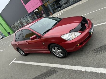 Красный Мицубиси Лансер, объемом двигателя 1.6 л и пробегом 285 тыс. км за 3650 $, фото 1 на Automoto.ua