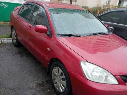Червоний Міцубісі Lancer, об'ємом двигуна 1.6 л та пробігом 350 тис. км за 4650 $, фото 1 на Automoto.ua
