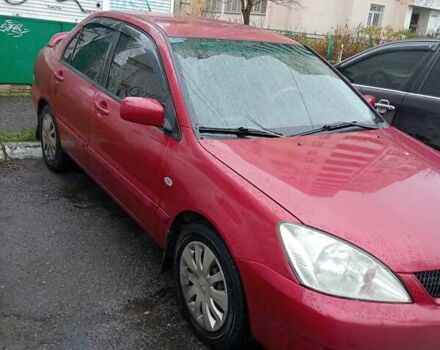 Красный Мицубиси Лансер, объемом двигателя 1.6 л и пробегом 350 тыс. км за 4650 $, фото 1 на Automoto.ua