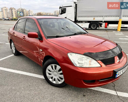 Червоний Міцубісі Lancer, об'ємом двигуна 1.6 л та пробігом 194 тис. км за 5500 $, фото 1 на Automoto.ua