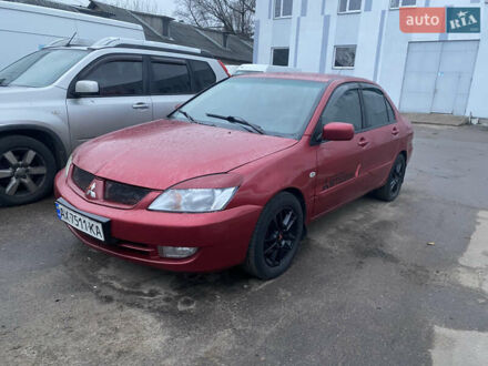 Червоний Міцубісі Lancer, об'ємом двигуна 1.58 л та пробігом 269 тис. км за 3899 $, фото 1 на Automoto.ua