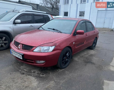 Червоний Міцубісі Lancer, об'ємом двигуна 1.58 л та пробігом 269 тис. км за 3899 $, фото 1 на Automoto.ua
