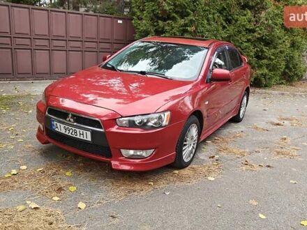 Красный Мицубиси Лансер, объемом двигателя 2 л и пробегом 186 тыс. км за 5600 $, фото 1 на Automoto.ua