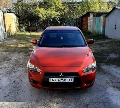 Червоний Міцубісі Lancer, об'ємом двигуна 2 л та пробігом 110 тис. км за 7500 $, фото 1 на Automoto.ua