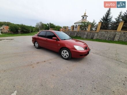 Червоний Міцубісі Lancer, об'ємом двигуна 1.58 л та пробігом 200 тис. км за 3200 $, фото 1 на Automoto.ua