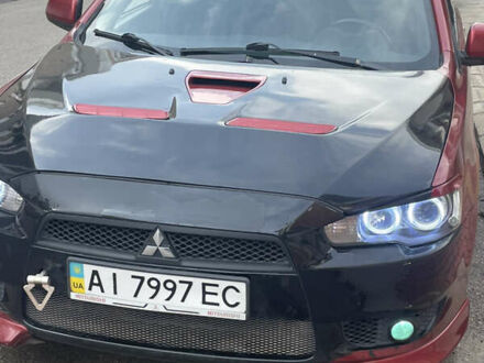 Красный Мицубиси Лансер, объемом двигателя 2 л и пробегом 275 тыс. км за 5500 $, фото 1 на Automoto.ua