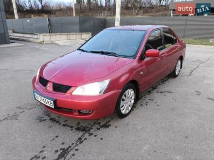 Красный Мицубиси Лансер, объемом двигателя 1.58 л и пробегом 140 тыс. км за 6000 $, фото 1 на Automoto.ua