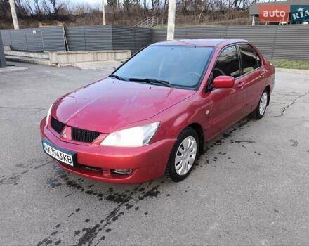Червоний Міцубісі Lancer, об'ємом двигуна 1.58 л та пробігом 140 тис. км за 6000 $, фото 1 на Automoto.ua