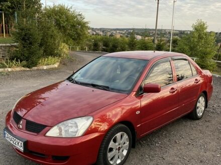 Червоний Міцубісі Lancer, об'ємом двигуна 1.3 л та пробігом 219 тис. км за 3600 $, фото 1 на Automoto.ua