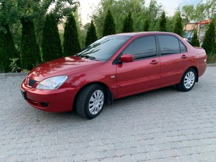 Червоний Міцубісі Lancer, об'ємом двигуна 1.6 л та пробігом 153 тис. км за 4950 $, фото 1 на Automoto.ua