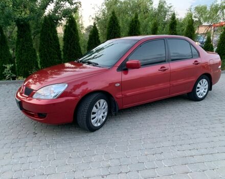 Красный Мицубиси Лансер, объемом двигателя 1.6 л и пробегом 153 тыс. км за 4950 $, фото 1 на Automoto.ua
